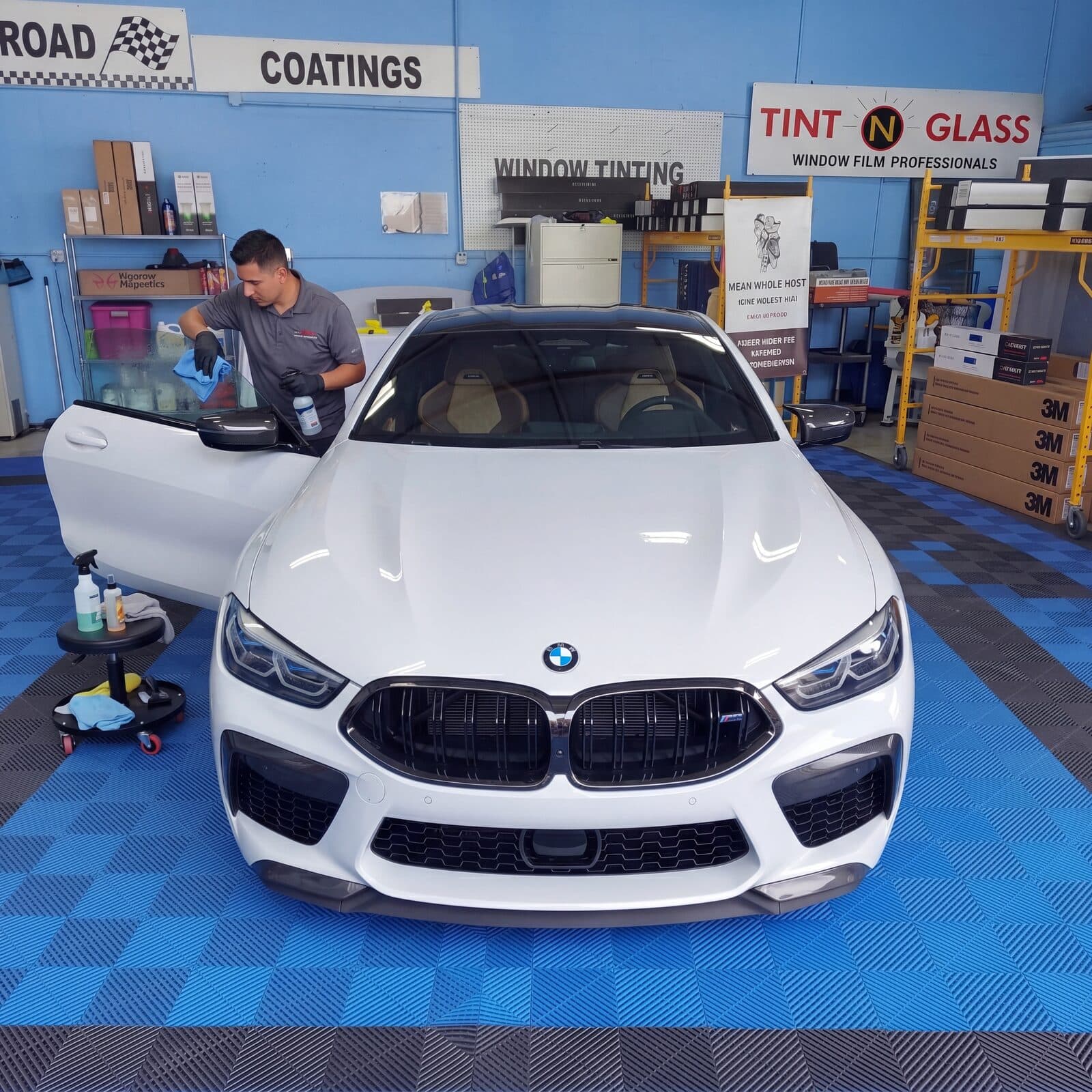 BMW front-end view in the bay during final install checks.