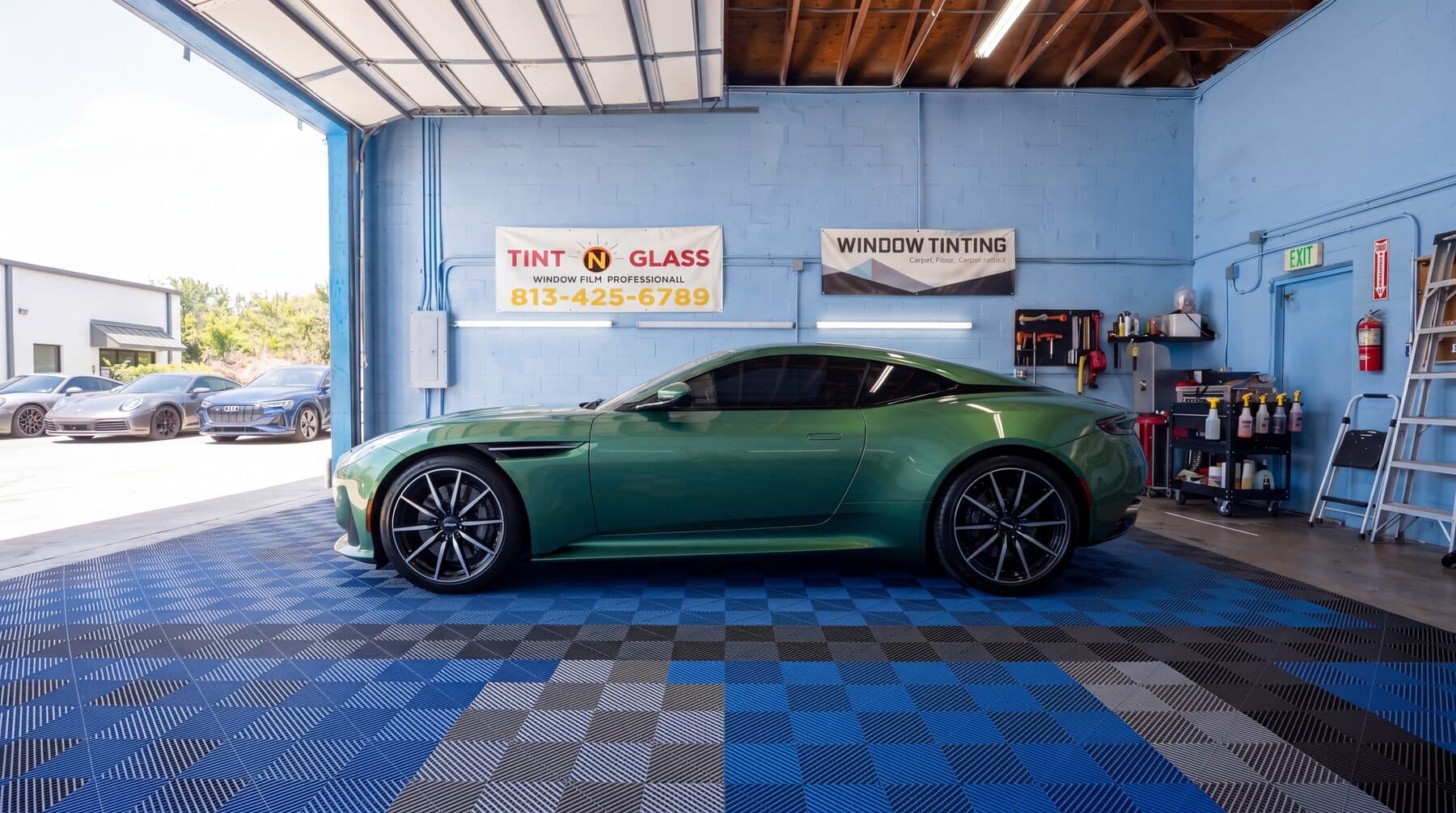 Green coupe staged in the bay after installation.