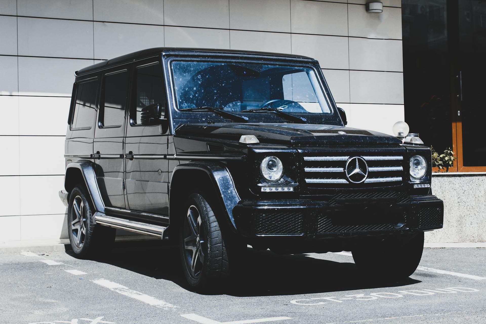 A freshly tinted car inside the Tint N Glass shop