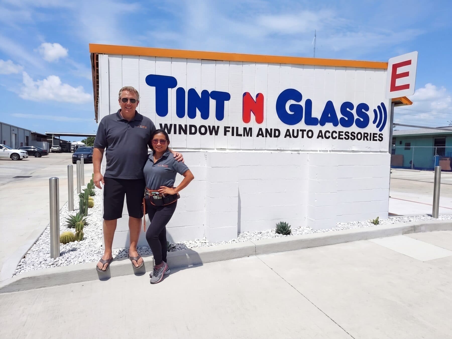 Tint N Glass team near vehicles representing service for Elfers