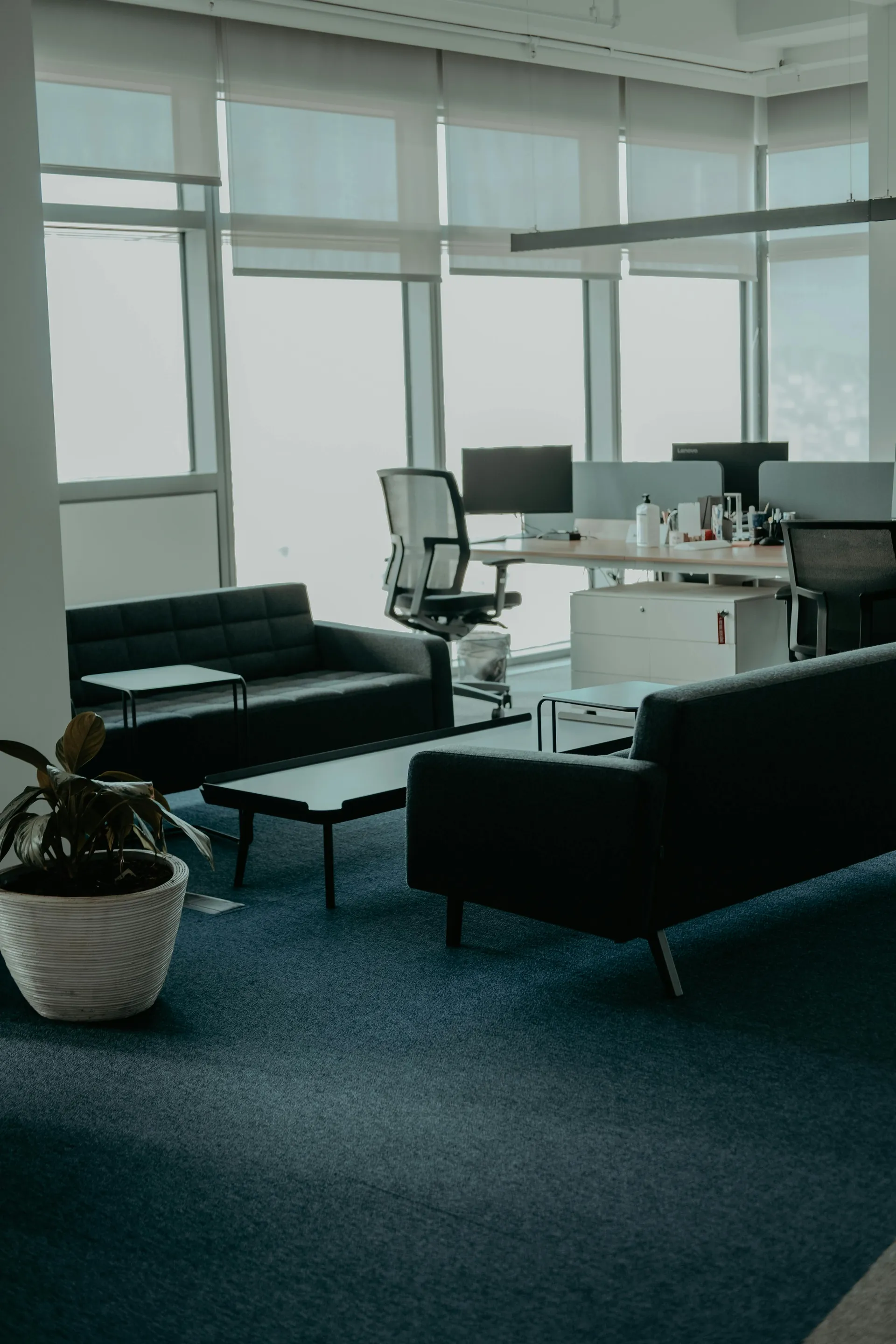 Modern office interior with tall glass windows